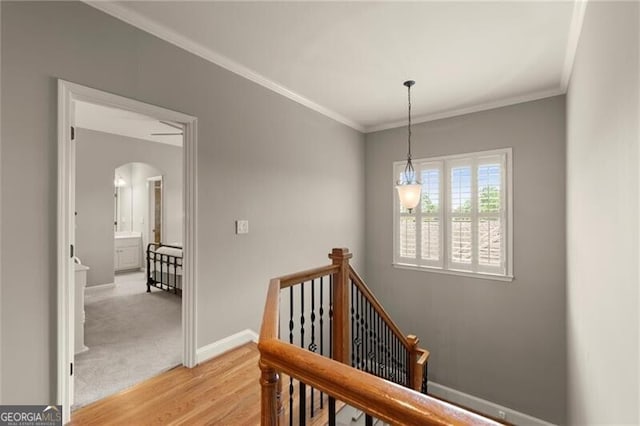 1286 Whisper Cove Dr, Buford, GA 30518 - staircase with arched walkways, crown molding, and wood finished floors
