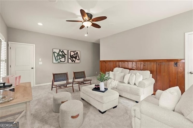 1286 Whisper Cove Dr, Buford, GA 30518 - living room with a ceiling fan, carpet, recessed lighting, a wainscoted wall, and wood walls