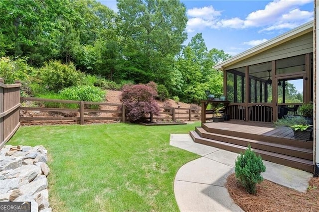 1286 Whisper Cove Dr, Buford, GA 30518 - view of yard featuring a wooden deck and a sunroom