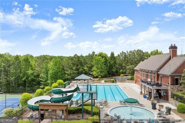 1286 Whisper Cove Dr, Buford, GA 30518 - community pool featuring a patio