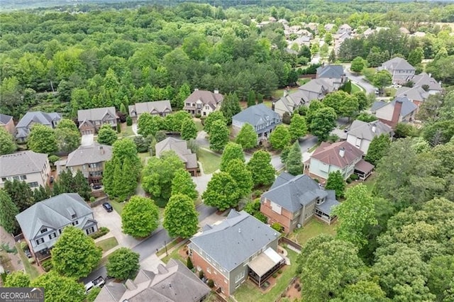 1286 Whisper Cove Dr, Buford, GA 30518 - aerial perspective of suburban area with a heavily wooded area
