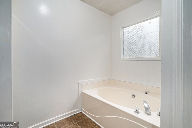 1235 Waterwood Dr, Loganville, GA 30052 - full bath with a garden tub and tile patterned floors