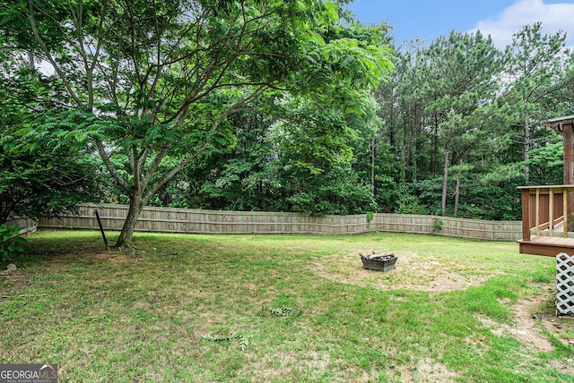 1235 Waterwood Dr, Loganville, GA 30052 - fenced backyard featuring a fire pit