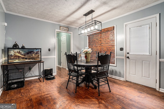 1235 Waterwood Dr, Loganville, GA 30052 - dining space featuring wood finished floors, a textured ceiling, and crown molding