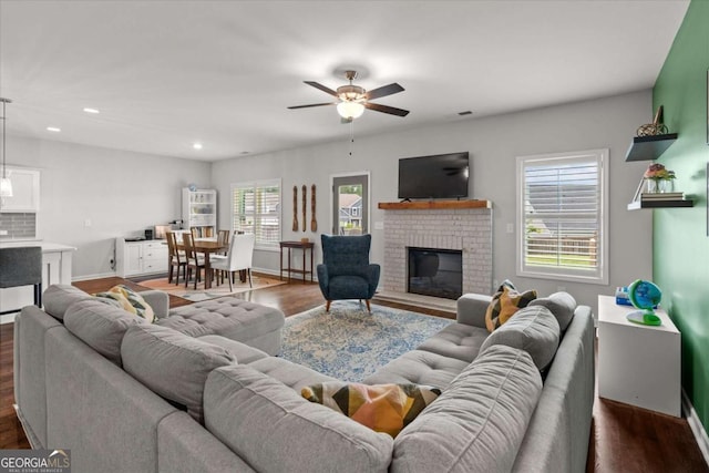 123 Cedar Park Way, Carrollton, GA 30117 - living area featuring dark wood-style flooring, ceiling fan, a fireplace, and recessed lighting