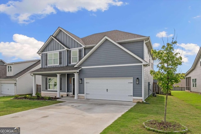 123 Cedar Park Way, Carrollton, GA 30117 - view of front of house with board and batten siding, concrete driveway, a front yard, and a porch