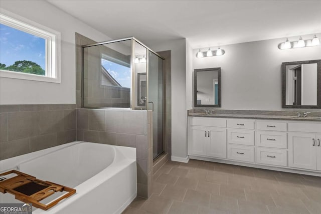 123 Cedar Park Way, Carrollton, GA 30117 - bathroom with a tub, double vanity, a shower stall, and tile patterned flooring
