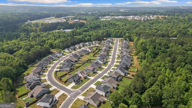 123 Cedar Park Way, Carrollton, GA 30117 - aerial view of property and surrounding area with a heavily wooded area and nearby suburban area