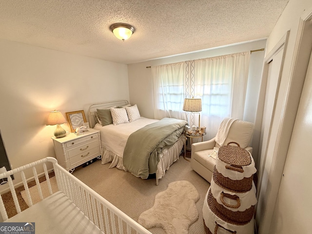 3095 Holbrook Dr SW, Marietta, GA 30060 - bedroom with a textured ceiling and light colored carpet