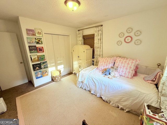 3095 Holbrook Dr SW, Marietta, GA 30060 - carpeted bedroom with a closet and a textured ceiling