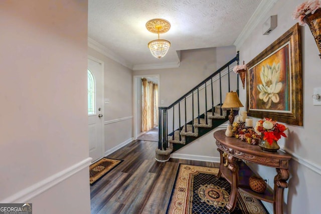 5293 Sandy Shoals Ln, Stone Mountain, GA 30087 - foyer with dark wood-style flooring, crown molding, a chandelier, stairs, and a textured ceiling