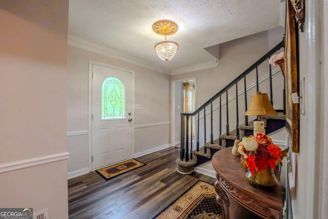 5293 Sandy Shoals Ln, Stone Mountain, GA 30087 - foyer entrance featuring wood finished floors, stairway, a textured ceiling, ornamental molding, and baseboards