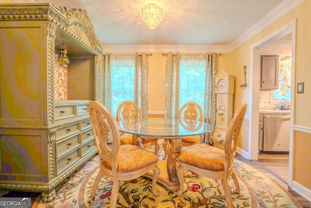 5293 Sandy Shoals Ln, Stone Mountain, GA 30087 - dining space featuring plenty of natural light, light wood-type flooring, a textured ceiling, and ornamental molding