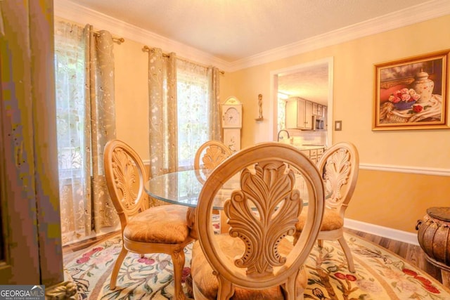 5293 Sandy Shoals Ln, Stone Mountain, GA 30087 - dining area featuring baseboards, crown molding, and wood finished floors