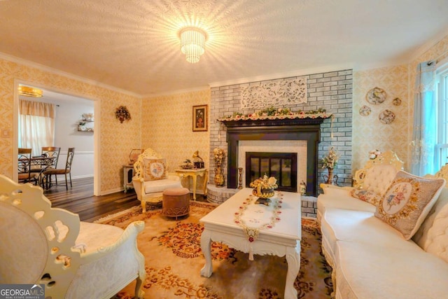 5293 Sandy Shoals Ln, Stone Mountain, GA 30087 - living room with wood finished floors, ornamental molding, wallpapered walls, and a fireplace