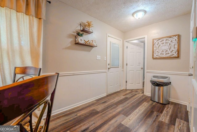 5293 Sandy Shoals Ln, Stone Mountain, GA 30087 - corridor with a textured ceiling, wood finished floors, and wainscoting