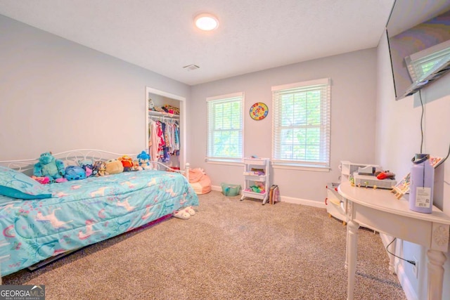 5293 Sandy Shoals Ln, Stone Mountain, GA 30087 - carpeted bedroom featuring baseboards and a closet