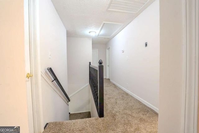 5293 Sandy Shoals Ln, Stone Mountain, GA 30087 - stairs with carpet flooring, a textured ceiling, attic access, and baseboards