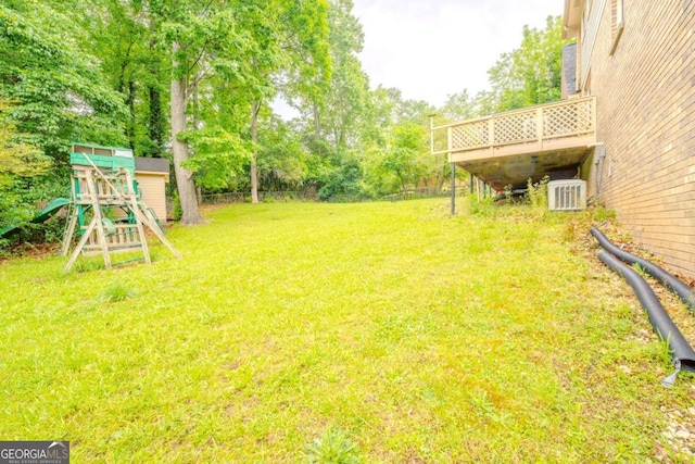 5293 Sandy Shoals Ln, Stone Mountain, GA 30087 - view of yard with a playground and view of wooded area