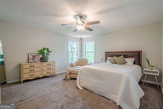 bedroom featuring carpet, a textured ceiling, baseboards, and ceiling fan