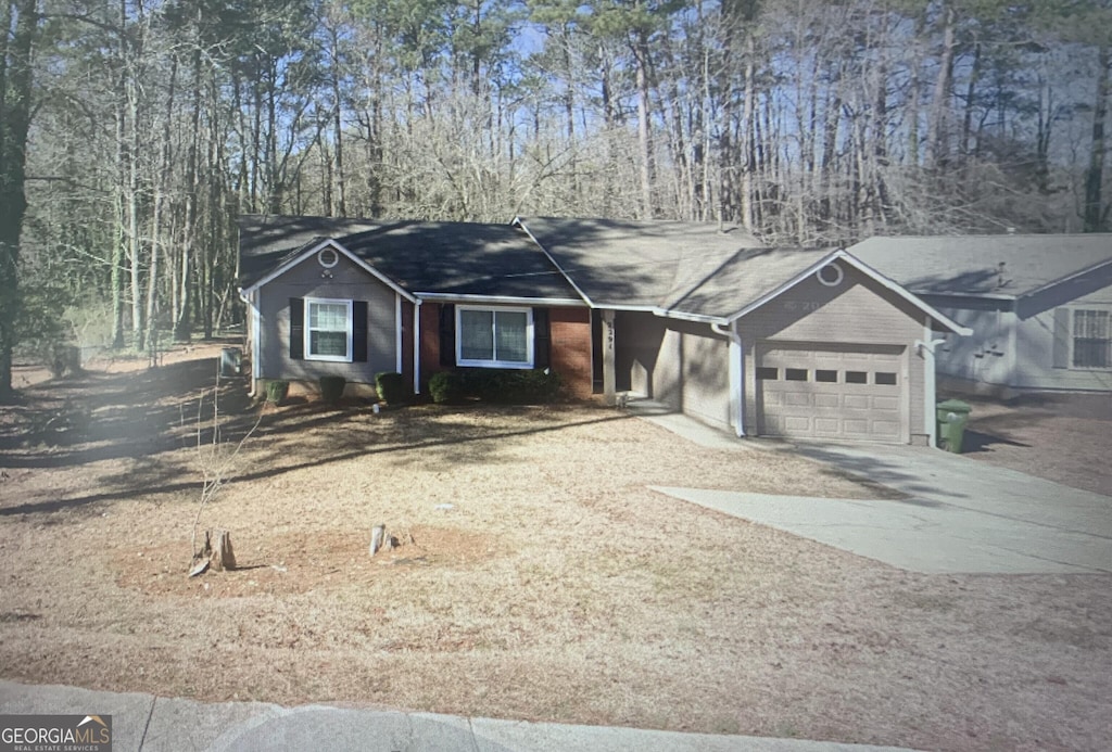 2291 County Line Rd SW, Atlanta, GA 30331 - ranch-style house featuring a garage and concrete driveway