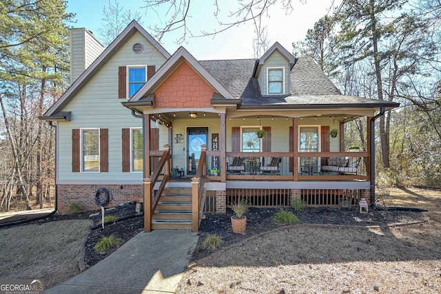 9001 E Carroll Rd, Winston, GA 30187 - view of front of property with a porch, a chimney, and a shingled roof