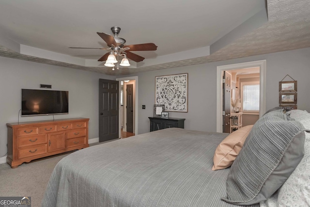 9001 E Carroll Rd, Winston, GA 30187 - bedroom with a tray ceiling, light carpet, baseboards, and a ceiling fan