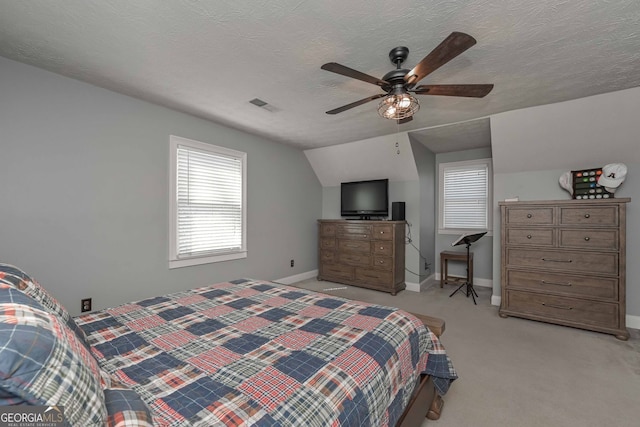 9001 E Carroll Rd, Winston, GA 30187 - bedroom featuring light colored carpet, baseboards, vaulted ceiling, ceiling fan, and a textured ceiling