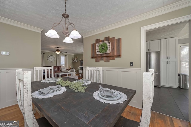 9001 E Carroll Rd, Winston, GA 30187 - dining area featuring a chandelier, ornamental molding, a decorative wall, a textured ceiling, and dark wood-style floors