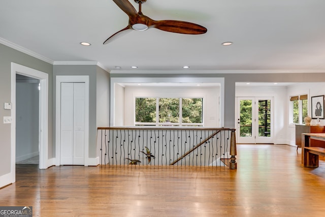 921 Oak Dr, Woodstock, GA 30189 - hallway featuring an upstairs landing, wood finished floors, baseboards, recessed lighting, and crown molding