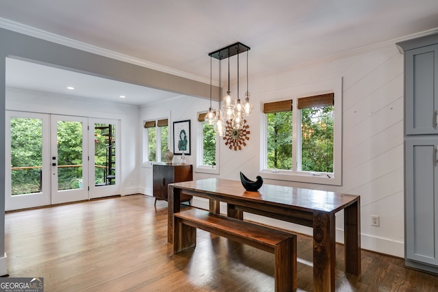 921 Oak Dr, Woodstock, GA 30189 - dining space with healthy amount of natural light, wood finished floors, ornamental molding, a chandelier, and baseboards