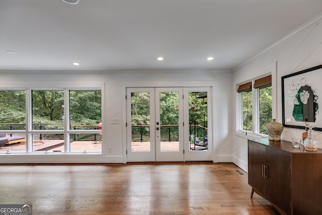 921 Oak Dr, Woodstock, GA 30189 - doorway featuring crown molding, plenty of natural light, wood finished floors, recessed lighting, and a decorative wall