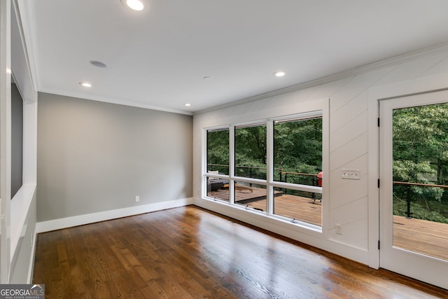 921 Oak Dr, Woodstock, GA 30189 - unfurnished room featuring crown molding, healthy amount of natural light, wood finished floors, recessed lighting, and baseboards
