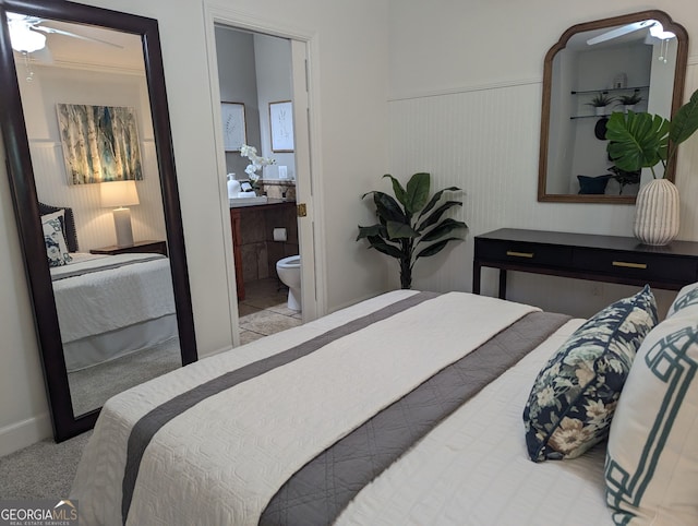 921 Oak Dr, Woodstock, GA 30189 - carpeted bedroom featuring a wainscoted wall and connected bathroom