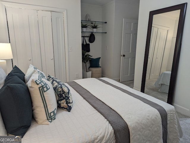 921 Oak Dr, Woodstock, GA 30189 - carpeted bedroom with baseboards, a closet, and ornamental molding