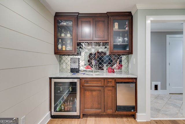 921 Oak Dr, Woodstock, GA 30189 - indoor wet bar with beverage cooler, crown molding, decorative backsplash, stainless steel refrigerator, and baseboards