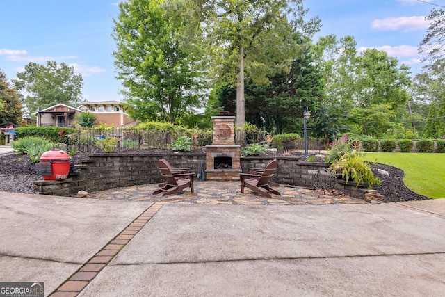 921 Oak Dr, Woodstock, GA 30189 - view of patio / terrace with an outdoor stone fireplace