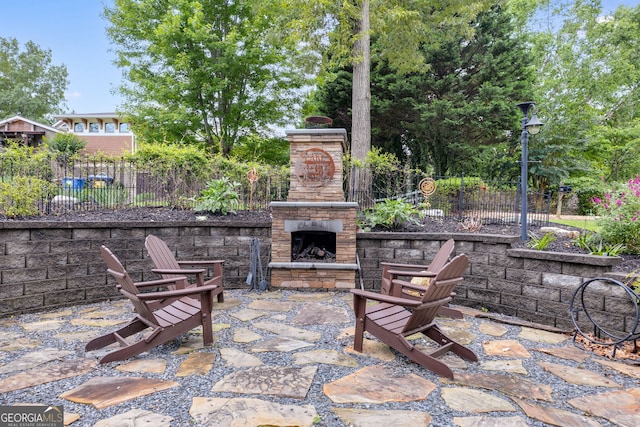 921 Oak Dr, Woodstock, GA 30189 - view of patio / terrace with an outdoor stone fireplace