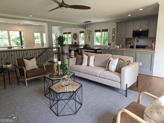 921 Oak Dr, Woodstock, GA 30189 - living room featuring wood finished floors, a ceiling fan, crown molding, and recessed lighting