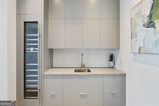 3107 Peachtree Rd NE Unit 2003Aka Ph3, Atlanta, GA 30305 - kitchen featuring a sink, modern cabinets, beverage cooler, and light countertops