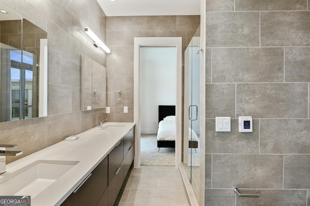 3107 Peachtree Rd NE Unit 2003Aka Ph3, Atlanta, GA 30305 - ensuite bathroom featuring double vanity, tile walls, and a stall shower