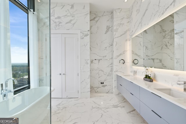 3107 Peachtree Rd NE Unit 2003Aka Ph3, Atlanta, GA 30305 - full bathroom with stone wall, double vanity, plenty of natural light, and a soaking tub
