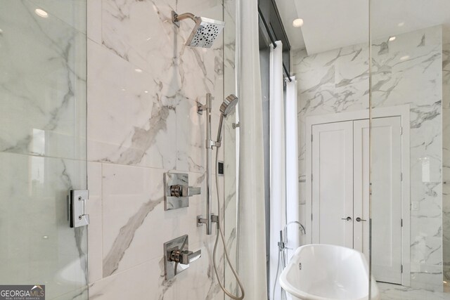 3107 Peachtree Rd NE Unit 2003Aka Ph3, Atlanta, GA 30305 - bathroom with a marble finish shower and a soaking tub