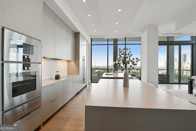 3107 Peachtree Rd NE Unit 2003Aka Ph3, Atlanta, GA 30305 - kitchen with modern cabinets, double oven, healthy amount of natural light, black electric stovetop, and recessed lighting