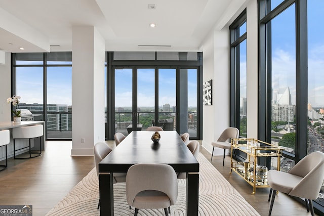 3107 Peachtree Rd NE Unit 2003Aka Ph3, Atlanta, GA 30305 - dining area featuring wood finished floors, a city view, baseboards, and expansive windows