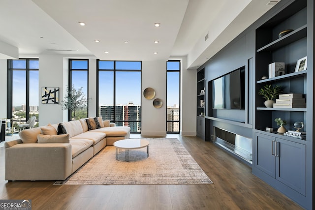 3107 Peachtree Rd NE Unit 2003Aka Ph3, Atlanta, GA 30305 - living room with built in shelves, expansive windows, dark wood-style flooring, recessed lighting, and baseboards