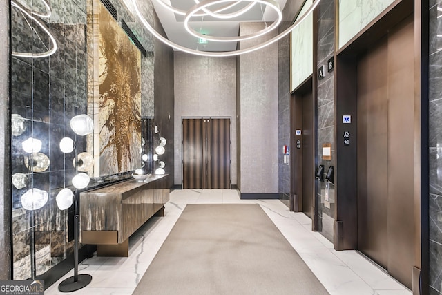 3107 Peachtree Rd NE Unit 2003Aka Ph3, Atlanta, GA 30305 - lobby with a high ceiling and tile walls