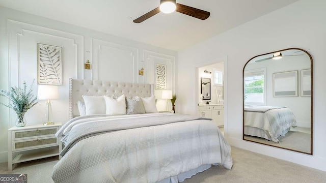 bedroom with carpet floors, connected bathroom, and a ceiling fan