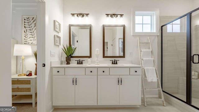 full bath featuring a stall shower and double vanity