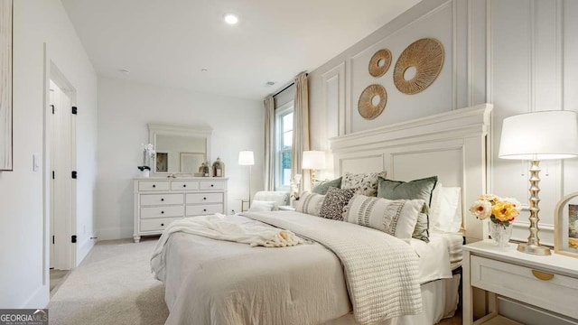 bedroom featuring light carpet